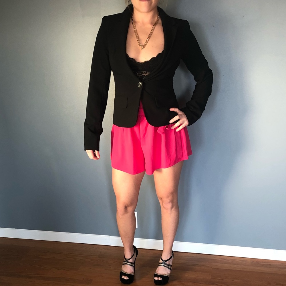 Hot pink shorts.